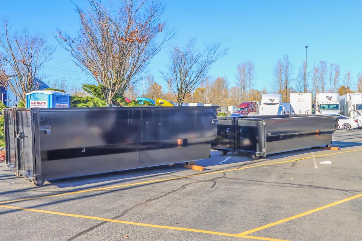 Professional dumpster rental service with roll-off container on residential driveway in Round Lake Beach